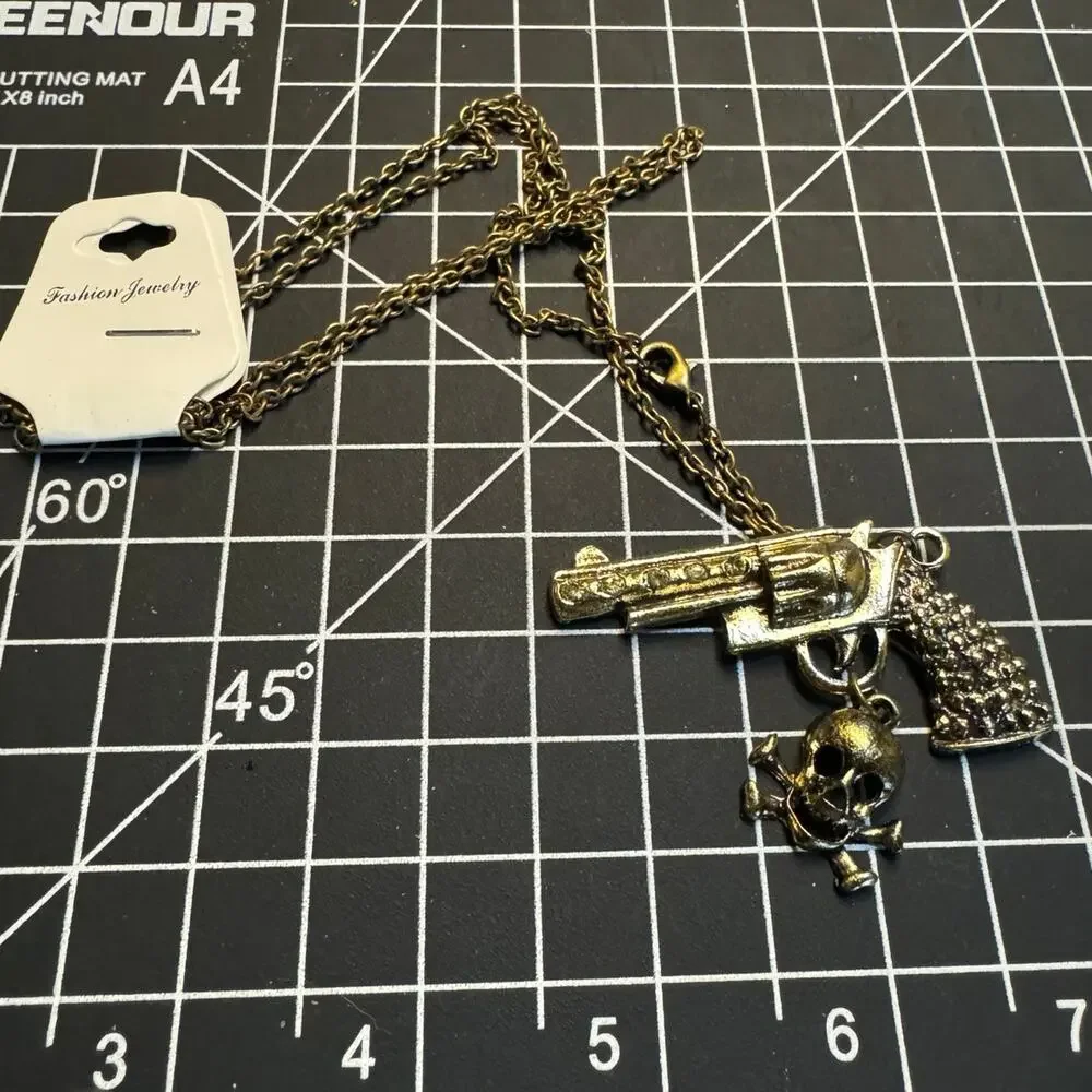 Antique gold tone rhinestone embellished pistol pendant necklace wester cowgirl